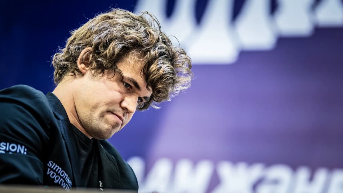 Magnus Carlsen inspects a chess move during a rapid event.