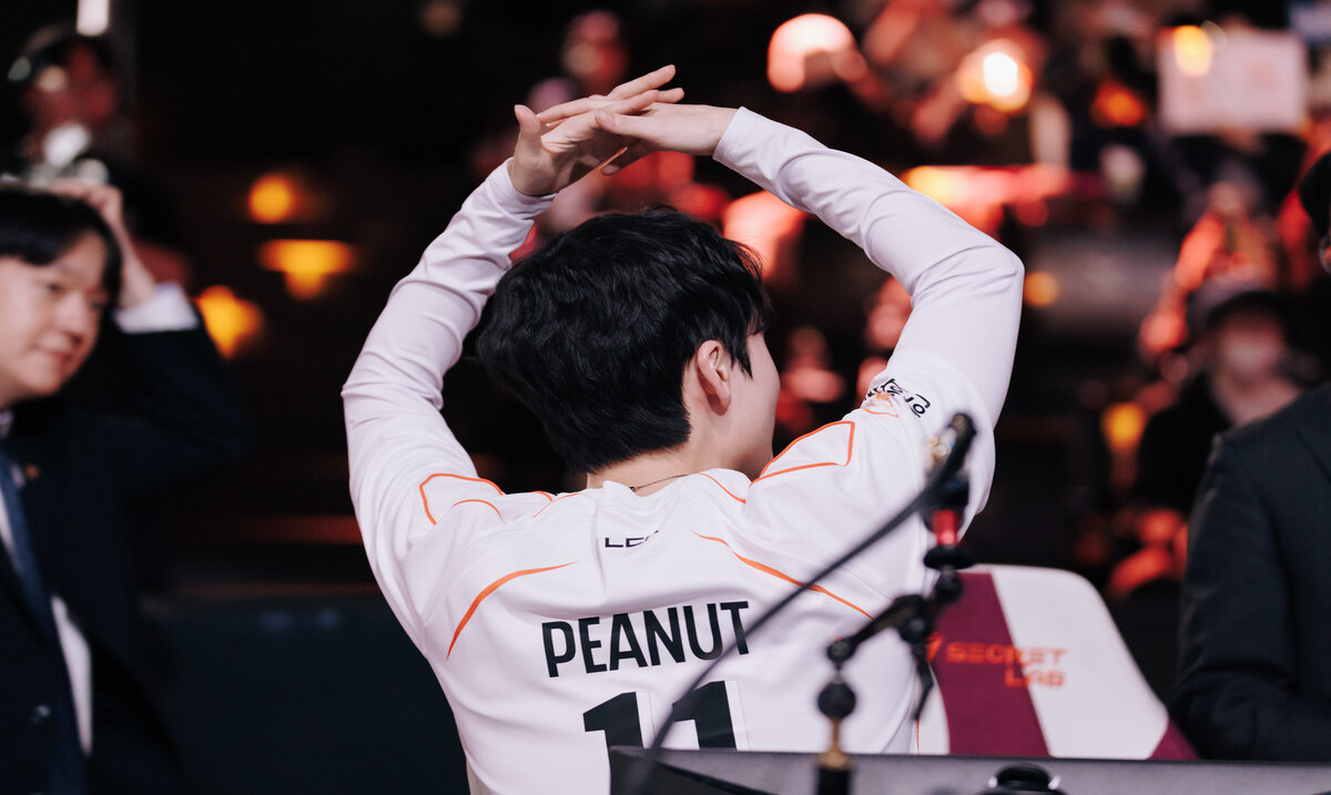 Peanut claps his hands to the crowd with his back turned to the camera, his name and number visible on the back of his jersey.