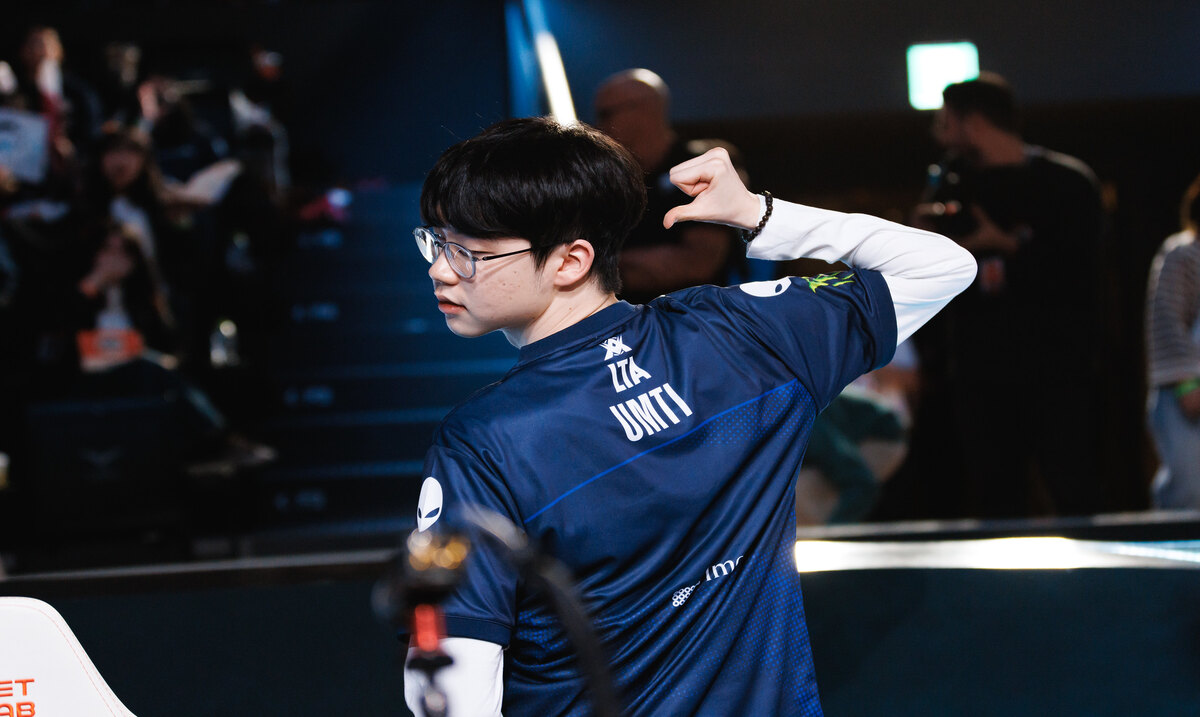 TL umTi point to his name on the back of his jersey as he celebrates a victory.